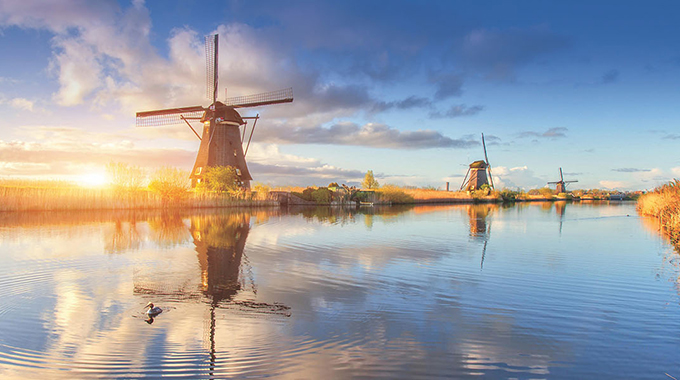 Windmills along the water in South Holland
